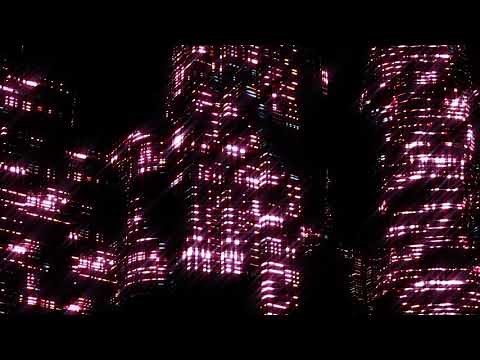 A two-hour screensaver with a flight in a neon-lit city at night.