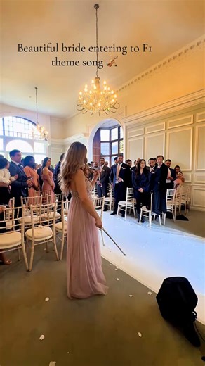 Lights out… and away ‘I do!’ 💍🏁What a way for the bride to make an entrance. (Via TikTok/Roxy_Violin)