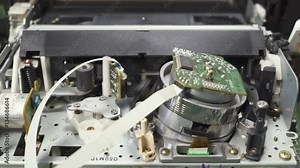 VHS, video player loads and reads the tape, the process of working vhs player, close-up. 4k footage. Camera movement. Close-up.