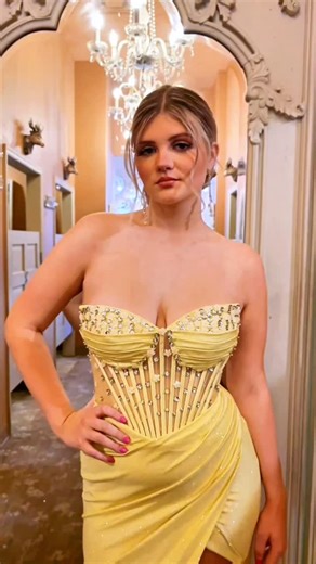 🚨 New Drop Alert! We've got a 💛 YELLOW dress that seems to be commanding a lot of attention lately. With its corset bodice, detailed embellishment, and sheer detailing... you'll surely be the girl walking into prom with confidence. 🥳 #promdress #yellowdress #couturedress #beautiful | Fancy Schmancy