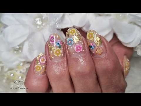 Encapsulated flowers with gold leaf and dots. Summer gel nails step by step