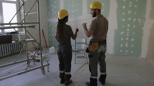 Construction Workers Reviewing Blueprint | Free Stock Video Footage