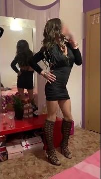 Slim Stylish Crossdresser in a Hot Mini Dress & Knee High Boots