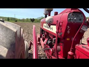 International Farmall 450 Tractor pulling a Cultimulcher