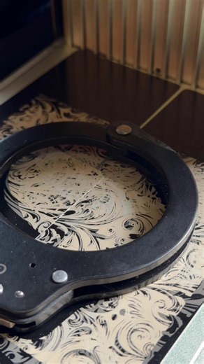 Fresh out of the laser engraver — a set of beautifully detailed, custom-engraved handcuffs made for an amazing deputy who just earned a well-deserved promotion. Congratulations, Investigator! 🕵️👏🔥 Proud to bring a little extra craftsmanship to celebrate your success. | Courageous Cuts & Crafts LLC