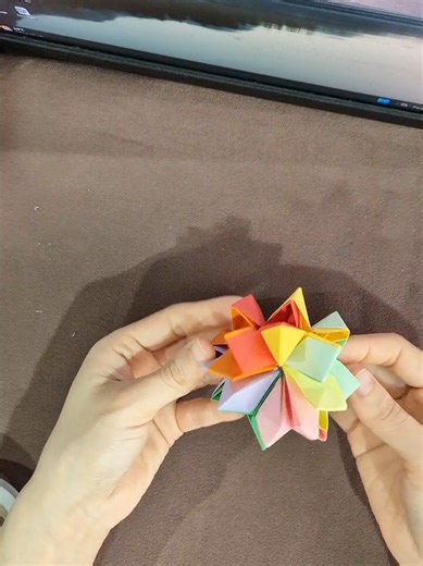 It's not just paper, it's magic! Watch how these folds transform into an amazing expandable magic ball. #magicball #origamimagicball #diytoy #paperfolding #geometryart