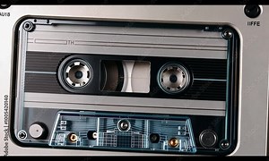 Close-up of a vintage cassette tape in a player