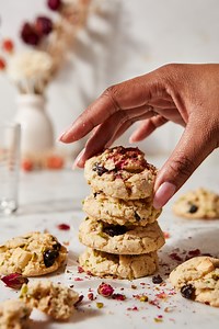As the end of Black History Month approaches, cookbook author Cheryl Day is here to share this fabulous recipe from gifted baker and cake artist, Dawn Konofaos. Dawn’s Rose-Pistachio Cookies with Cherries and White Chocolate are delicate works of edible art — and vegan! “I created these cookies for the lovely Black femme entrepreneurs who have impacted my life in the most profound ways,” says Dawn. “I cherish the bond we have, and I’m forever grateful for their friendship. We call them goddess c