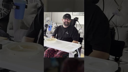 Neuralink user controls a robot arm with hand movements