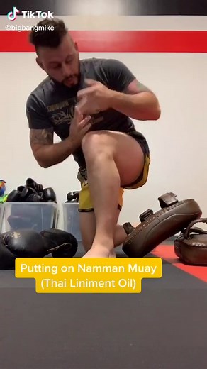Applying Limiment Oil: Namman Muay Thai Boxing Liniment Oil