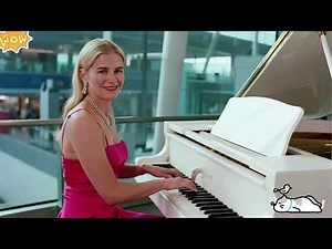 Beautiful woman playing a melodious piano piece