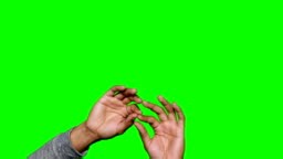 Hands pretending to touch an invisible screen against green background