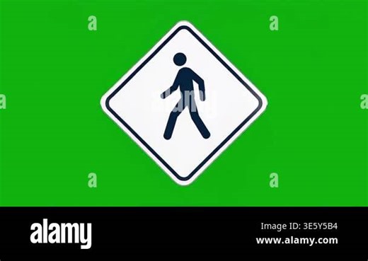 A diamond-shaped traffic sign indicating a pedestrian crossing is displayed against a solid green screen background Stock Video Footage - Alamy