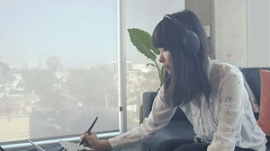 A graphic designer working on a tablet  - Free Stock Video
