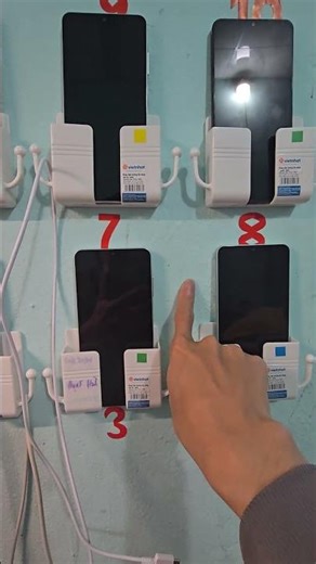 Wall-mounted shelf for phones, remotes, and other electronic devices.