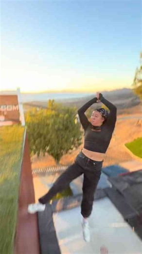 Aerial to swan dive tramp wall trick attempt