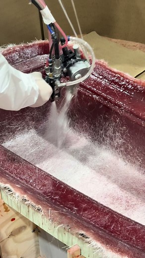 Spray-up in progress, then rolling it out to compact the laminate and eliminate trapped air for a clean, consistent layup. #NuWaveComposites #MoldMaking #CompositeManufacturing #SprayUp #Fiberglass