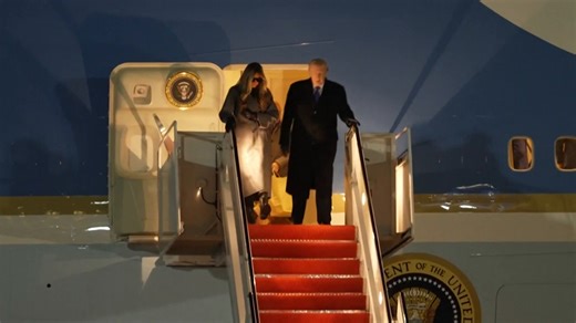 Melania Trump wears sunglasses at night as she exits Air Force One