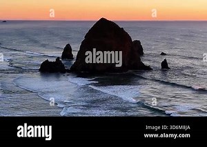 Haystack rock, gentle waves - Cannon Beach at sunset