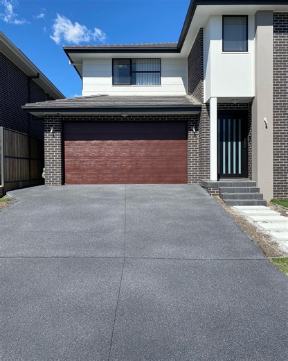 DecoCrete Concrete Resurfacing | A bluestone coloured fauxstone finish on driveway and the paver stepping stones sprayed in White with a black fleck | Instagram