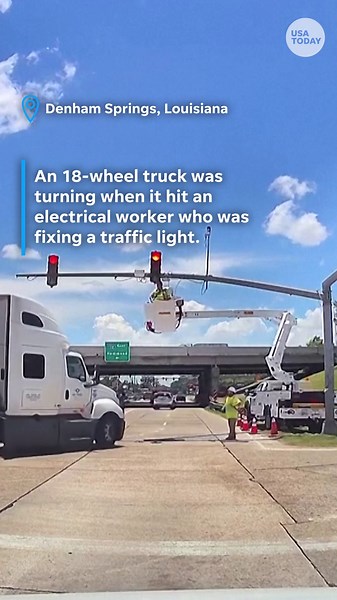 Semi truck rams electrical worker, leaving him dangling upside down