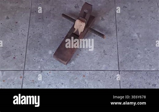 Top view of a traditional manual wood planer tool on a grey textured stone surface for woodworking and craft concepts Stock Video Footage - Alamy