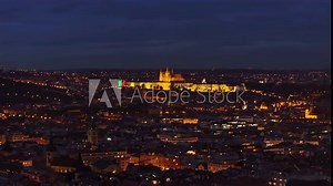 Captivating twilight views of Prague reveal the illuminated Castle, showcasing the city's remarkable architecture and vibrant skyline against a dusky sky