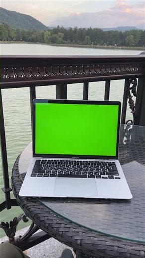 Laptop Green Screen on a Balcony with a Scenic Lake View - Stock Video Free To Use HD 4K