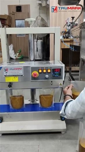 Gravy Pouch Packing Machine | Piston Filling Machine + Vertical Band Sealer