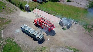 Firefighters extinguish burning garbage can, aerial footage, drone Stock Video