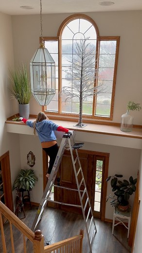 I love this entry display! We got the tree at either Costco or Sam’s Club (I forget!) the year we moved in here. It has a built in timer and is so pretty! The presents and deer are Hartville Thrift Shoppe finds!! 👏🏼 There has been a deflated balloon and a dog toy up there for months thanks to my kids! I always dread bringing that huge ladder in but I was happy to finally get those down and clean up the dust! Although….while holding the vacuum in the air like that, I said out loud “this is craz