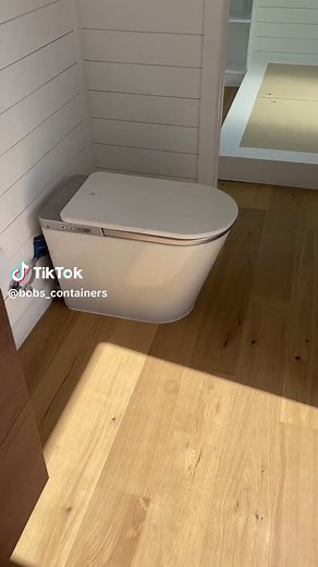 Who says container homes can't be glamorous? Introducing our sensor-activated, bidet-equipped toilet—because even in a compact space, elegance knows no bounds. 🌟✨ Watch to witness the pinnacle of luxury living! Questions or have your own ideas? Reach out! 833-265-3269 Bobscontainer.com #BobStyle #ContainerGoals #ContainerChic #BobInnovation #containerhouse #containerhome #tinyhouse #shippingcontainerhouse #containerhomes #container #shippingcontainerhome #shippingcontainer #containeroffice #con