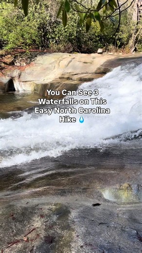 Did you know you can see three waterfalls on one short hike in North Carolina? 💧 Tucked away in the mountains near Balsam Grove, NC, this peaceful trail follows the North Fork French Broad River and leads to the beautiful Mill Shoals Falls, where you’ll also find the remains of a historic old mill beside the cascading water. It’s a quiet and scenic spot with multiple waterfalls, mossy rocks, and the calming sound of the river flowing through the forest. ⚠️ The trail crosses private property tha