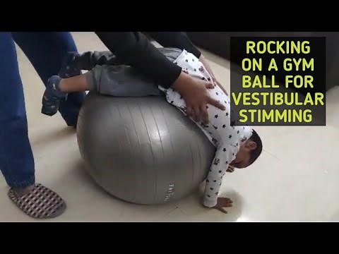 Rocking on a gym Ball for vestibular stimming #autismfamilyvlogs #autismfamily