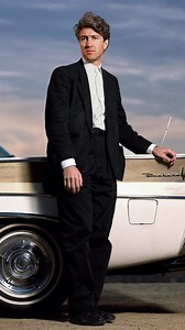 David Lynch Interview with Barry Norman on BBC, Cannes Film Festival, 1990 Recorded just days before Wild at Heart would go on to win the Palme d’Or, this BBC interview features David Lynch in conversation with Barry Norman during the 1990 Cannes Film Festival. Lynch discusses the translation of ideas into film, his ongoing fascination with 1950s America, and an oddly significant detail—his untied shoelace, which he jokingly suggests might bring him luck. The segment captures a moment of anticip