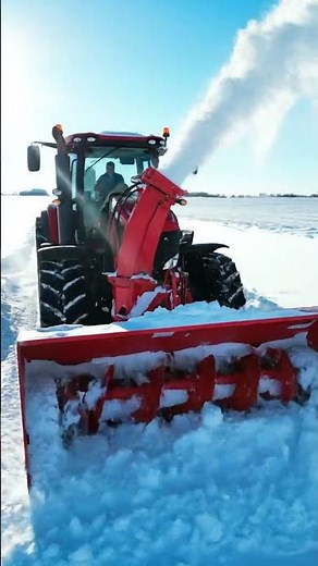 Tractor Plowing Through Heavy Snow