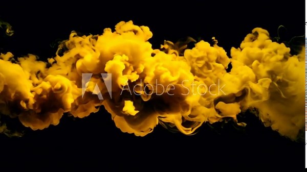 Energetic yellow smoke explosion against a dark backdrop, symbolizing creativity and dynamic movement in high-resolution ultra full hd black background 4k video download.