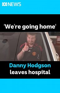 "We're going home." Soccer player Danny Hodgson walked out of hospital today to the delight of his family and supporters. STORY: https://ab.co/3wmtiQa. Danny's mother and father were by his side as he left hospital where he was undergoing rehabilitation from a severe traumatic brain injury. "I can't stop smiling we have our boy back," Danny's mum Nicola said. "Danny said he would walk out of hospital and he did. [It's] still a long road ahead but we have each other. "Rehabilitation from home wil