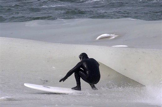 Surfers brave subzero temperatures to ride rare slushy waves in Montauk