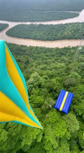 Epic Cliff Jump into Inflatable! 🤯 #NatureThrill