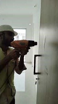Door shutter laminate bubble removing process by pressing, using a heat gun.