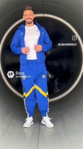 Man flapping windbreaker pants of Boca Jr in Wind Tunnel