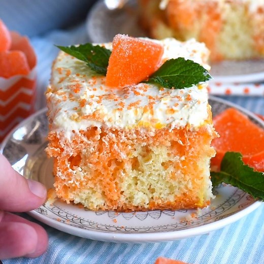 This easy Orange Creamsicle Poke Cake features a lovely vanilla cake that is bursting with orange flavor and topped with a fluffy orange and vanilla frosting that no one will be able to resist. PRINT RECIPE HERE: https://www.momontimeout.com/orange-creamsicle-cake-recipe/ | Mom On Timeout
