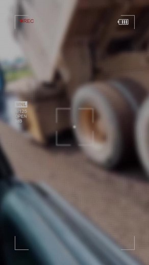 Road Paver in Action: Asphalt Spreading Demonstration