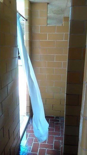 Simplicity: Dressing Room Curtain Caught in Breeze