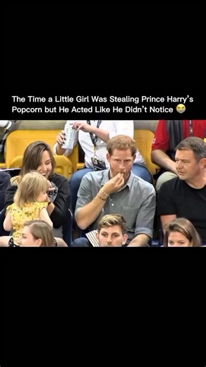 @sounds.good48 on Instagram: "At the Invictus Games in 2017, a little girl sitting next to Prince Harry began stealing popcorn from his bucket. He saw it but acted like he didn’t notice. Instead of stopping her, he smiled and played along. The moment showed his humor and gentle nature. The clip went viral for its pure and lighthearted charm. via : royalchannel/YT #history #past #backintime historychannel oldtimes pastlives"