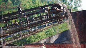 Conveyor on site at gravel pit. Operating conveyor belt at a gravel quarry.