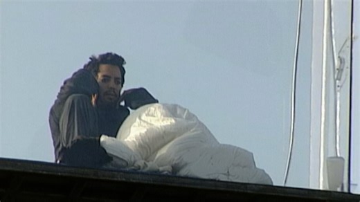 2003: David Blaine waves to the public from his clear suspended box