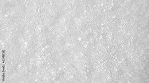 Iodized salt is a crucial dietary element, vital for thyroid function and preventing iodine deficiency. This macro video showcases its crystalline structure and the integration of iodine.