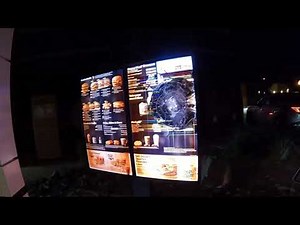 McDonald's Drive-Thru Dystopia, Helicopter hovers over Cybertruck-esque Smashed Menu Board, Phoenix